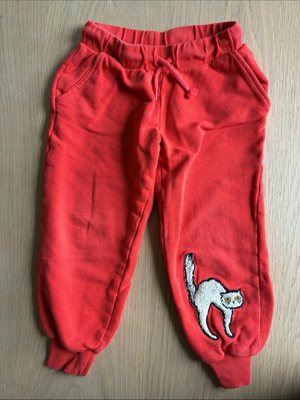 Mini Rodini Kids Red Jogger Pants with furry Cat Patch